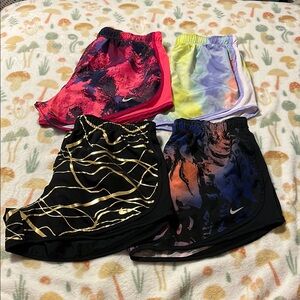 Lot of 4 Nike women’s medium dri-fit shorts colorful running sports activewear